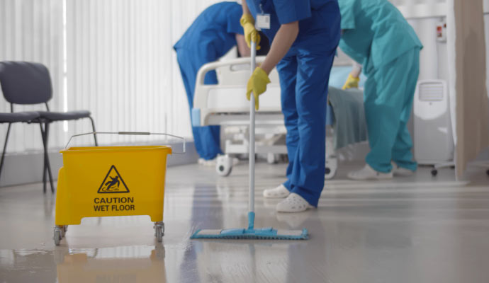 Professional team cleaning commercial floor