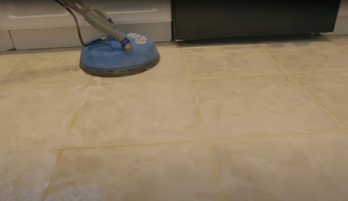 dirty tile cleaning with a scrubbing machine