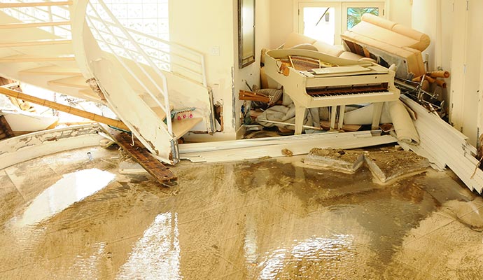 flooded living room with a white damaged piano