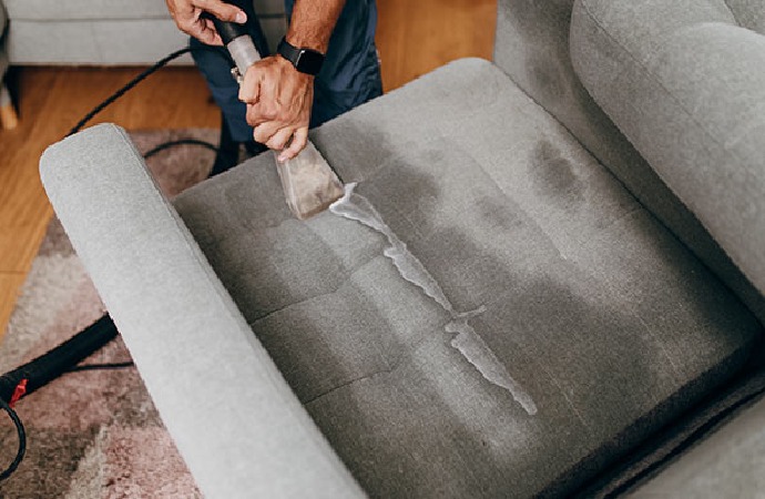 Worker Cleaning Polyester Upholster