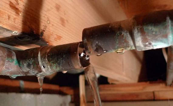 A broken water pipe is causing water to leak.